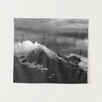 White clouds over the dark mountains
