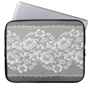 White colour straight strip of lace fabric on grey laptop sleeve