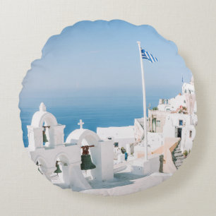White concrete building near body of water in the round cushion