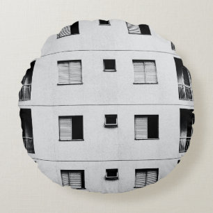 White concrete building round cushion
