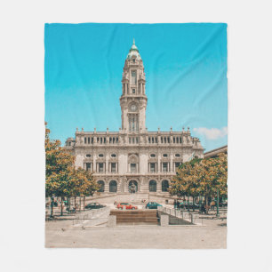 WHITE CONCRETE BUILDING UNDER BLUE SKY DURING DAYT FLEECE BLANKET