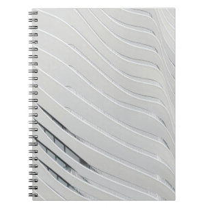White concrete building wall notebook