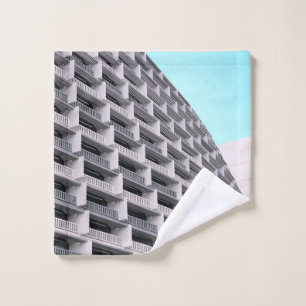 White concrete building with terraces wash cloth
