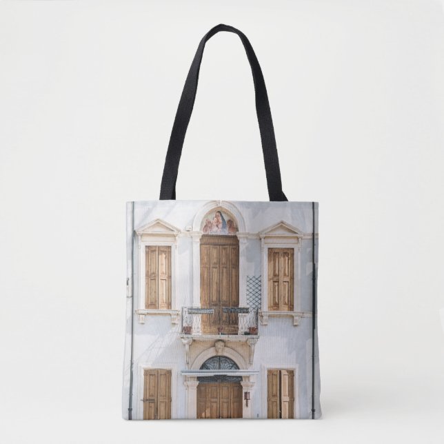 WHITE CONCRETE BUILDING WITH WOODEN DOORS AND WIND TOTE BAG (Front)