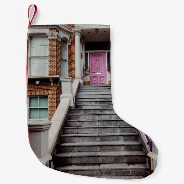WHITE CONCRETE HOUSE SHOWING CLOSED PURPLE WOODEN  SMALL CHRISTMAS STOCKING (Front)