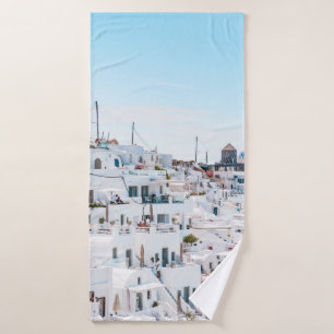 White concrete houses under blue sky at daytime bath towel