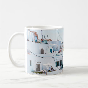 White concrete houses under blue sky at daytime coffee mug