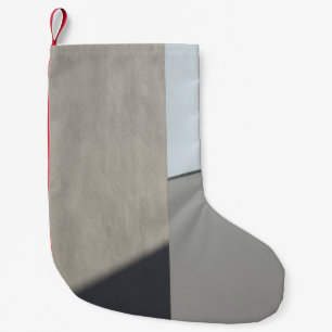 White concrete wall in the morning small christmas stocking