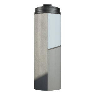 White concrete wall in the morning thermal tumbler