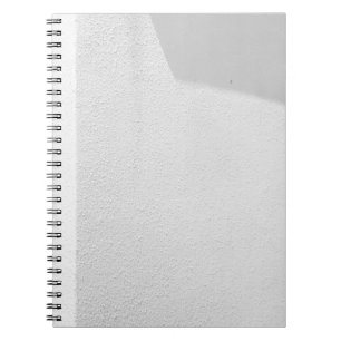 White concrete wall notebook