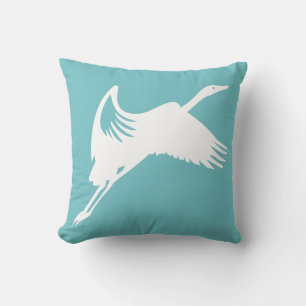 white crane on teal blue pillow