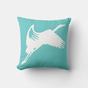 white crane on teal blue pillow
