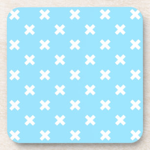 White cross stitches on baby blue coaster