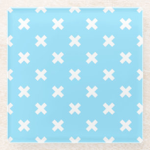 White cross stitches on baby blue glass coaster
