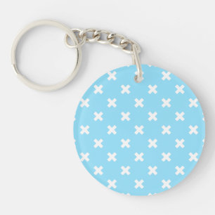 White cross stitches on baby blue key ring