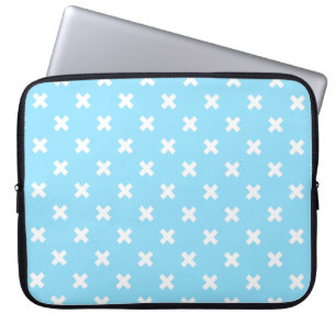 White cross stitches on baby blue laptop sleeve