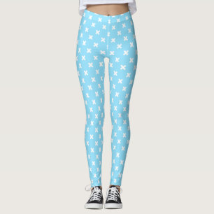 White cross stitches on baby blue leggings