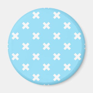 White cross stitches on baby blue magnet
