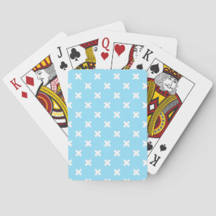 White cross stitches on baby blue playing cards