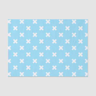 White cross stitches on baby blue tissue paper