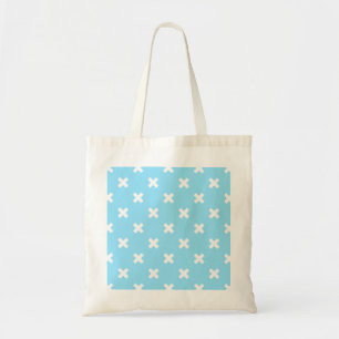 White cross stitches on baby blue tote bag