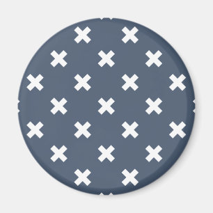 White cross stitches on blue-grey magnet