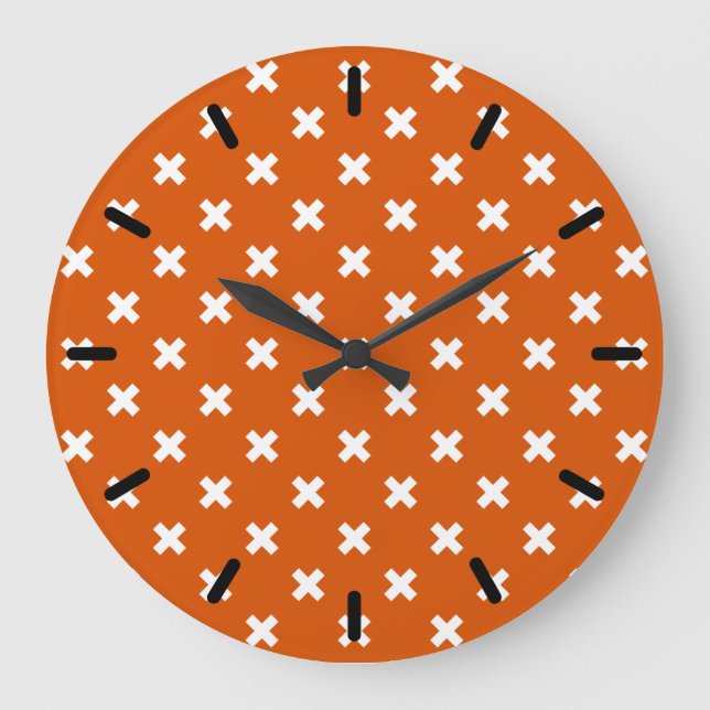 White cross stitches on burnt orange large clock (Front)