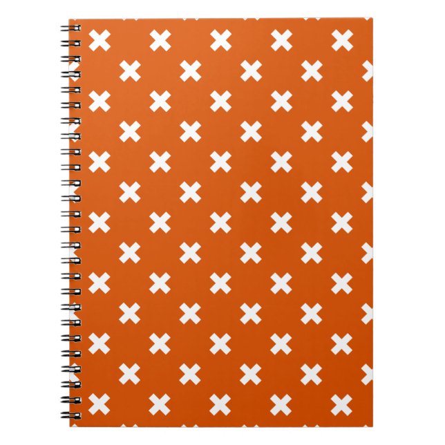 White cross stitches on burnt orange notebook (Front)