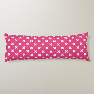White cross stitches on fuchsia body cushion