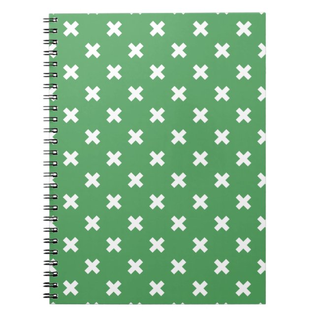 White cross stitches on green notebook (Front)