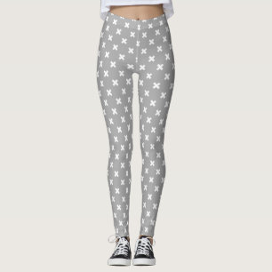 White cross stitches on grey leggings