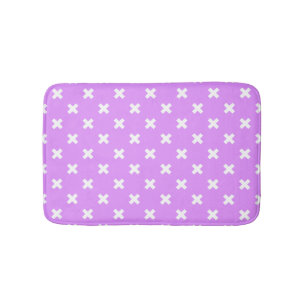White cross stitches on lilac bath mat