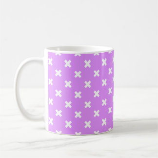 White cross stitches on lilac coffee mug