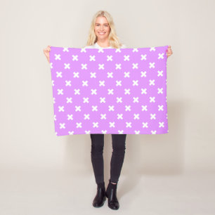 White cross stitches on lilac fleece blanket