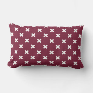 White cross stitches on mulberry lumbar cushion