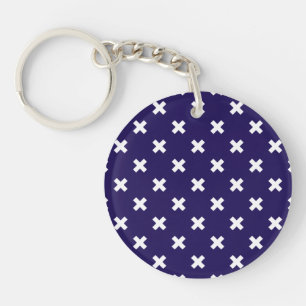 White cross stitches on navy blue key ring