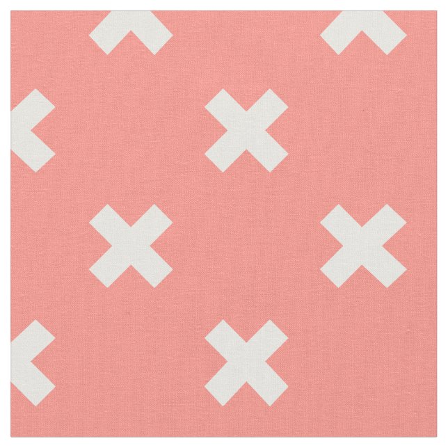 White cross stitches on peach fabric (Close Up)