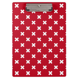 White cross stitches on red clipboard