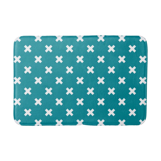 White cross stitches on teal bath mat (Front)