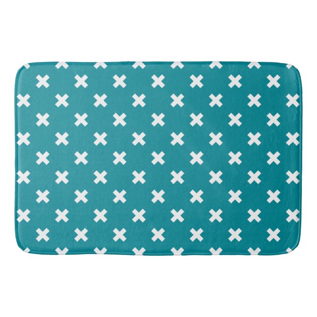 White cross stitches on teal bath mat (Front)