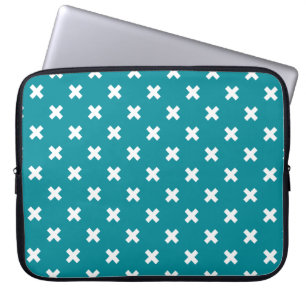 White cross stitches on teal laptop sleeve