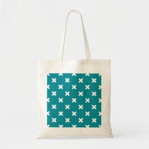White cross stitches on teal tote bag