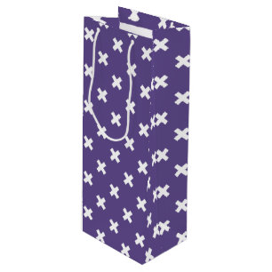 White cross stitches on ultra violet wine gift bag