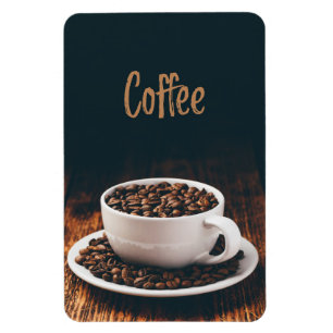 White cup full of roasted coffee beans magnet