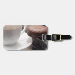 White cup of hot chocolate and cookies luggage tag