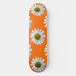White daisies on orange skateboard