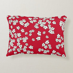White daisies on red and grey decorative cushion