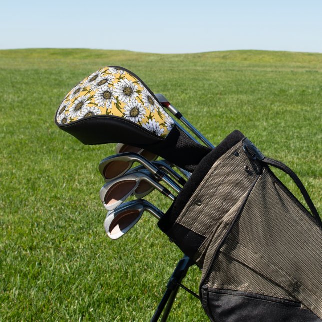 White daisies, wild flowers on yellow golf head cover (In Situ)