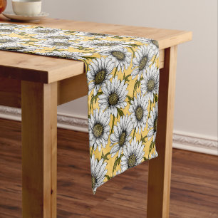 White daisies, wild flowers on yellow short table runner