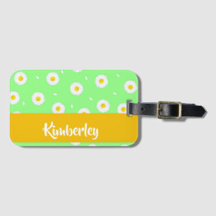 White daisy on green luggage tag